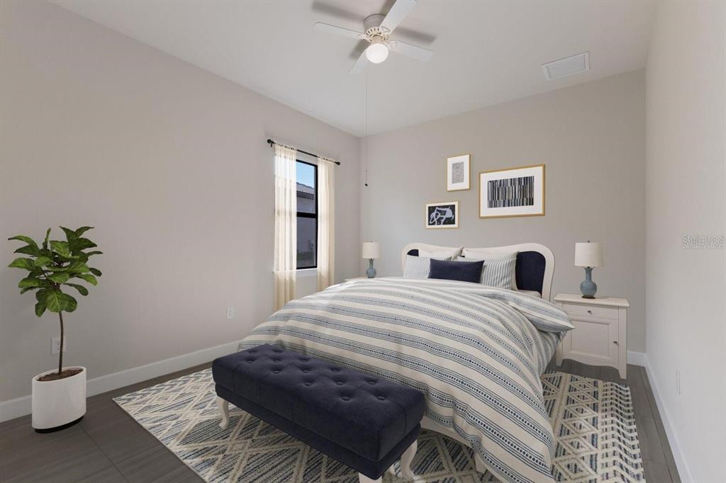 712 Sigsbee Loop Sarasota, FL 34240 - Photo 21 of 59 a bedroom with a bed and a potted plant