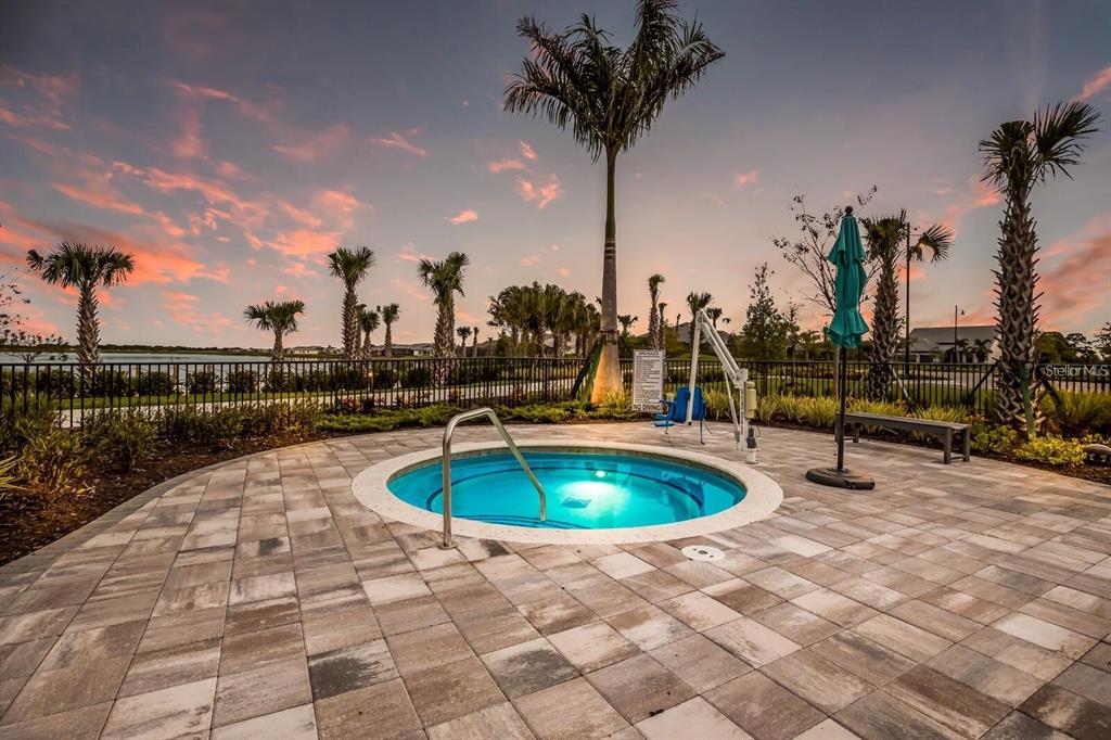 712 Sigsbee Loop Sarasota, FL 34240 - Photo 45 of 59 a view of a swimming pool with a patio