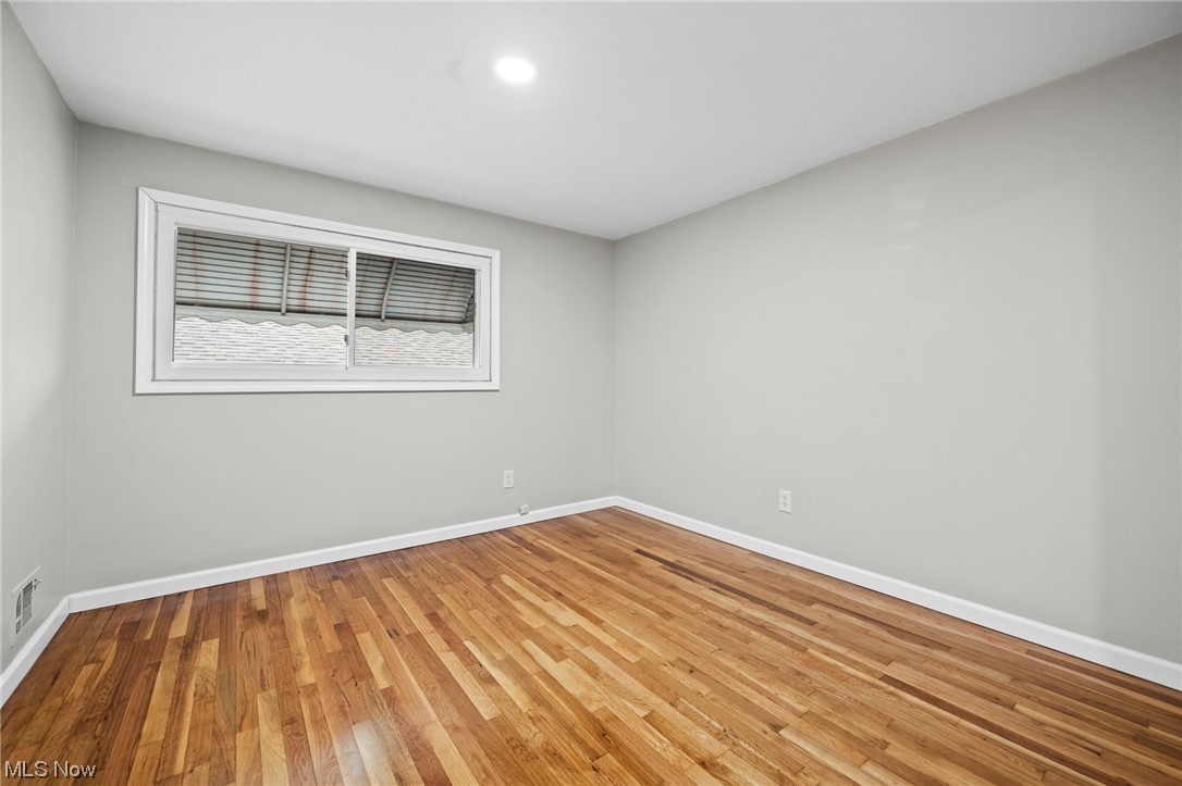 11417 Snow Road Parma Heights, OH 44130 - Photo 15 of 32 bedroom with light hardwood flooring