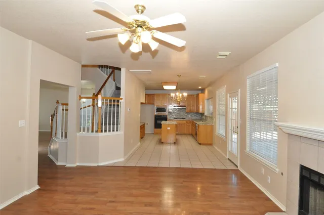 a view of a room with wooden floor