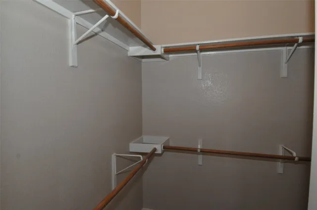 a bathroom with a bathtub and a window