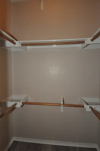 a bathroom with a shower and a glass door