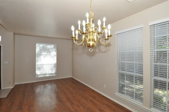 a view of a chandelier in a room with a window