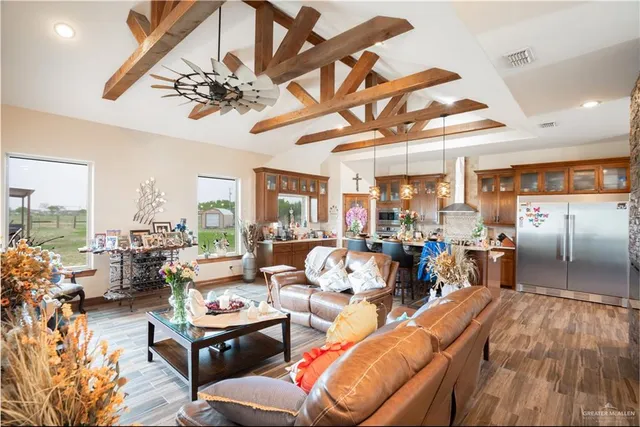 a very nice looking living room with a large window