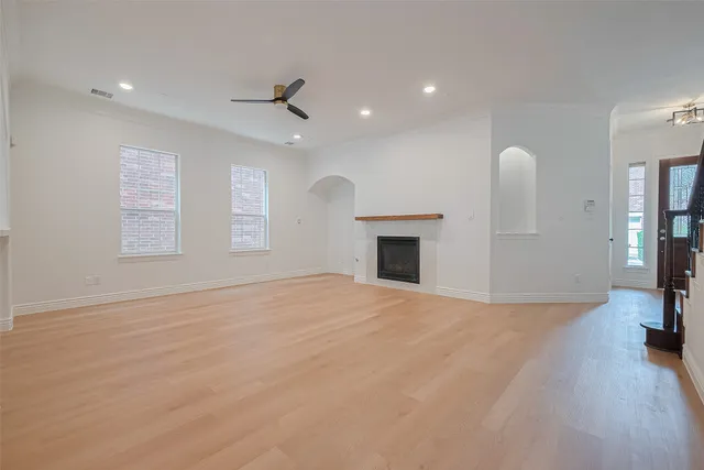 a kitchen with stainless steel appliances a stove microwave and sink