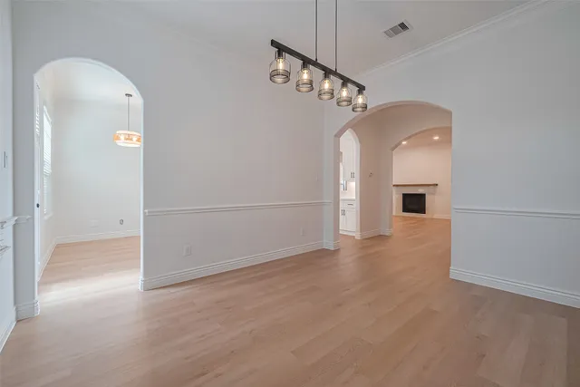a kitchen with cabinets appliances and a sink