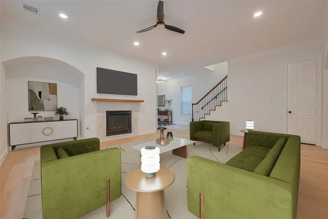 a living room with furniture and a fireplace
