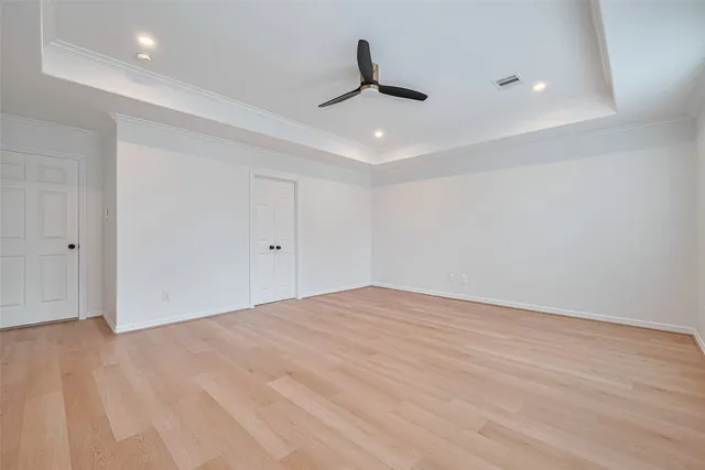 a view of a livingroom with a ceiling fan and window