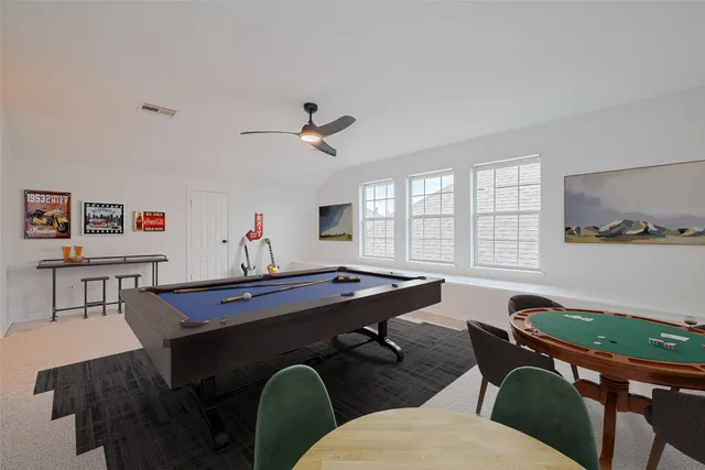 a spacious bedroom with a bed a couch and a couch