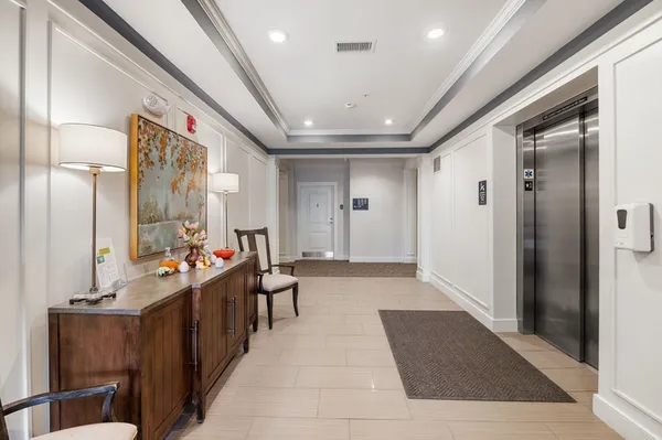 a lobby with furniture and window