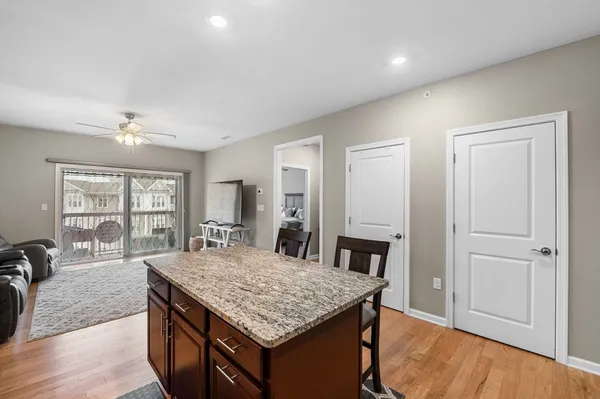 a kitchen with a table and chairs