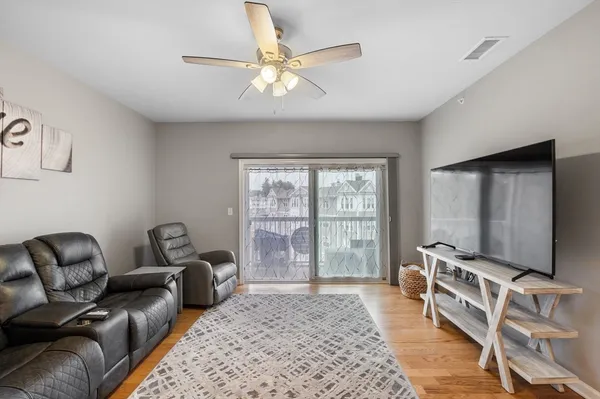 a living room with furniture and a window