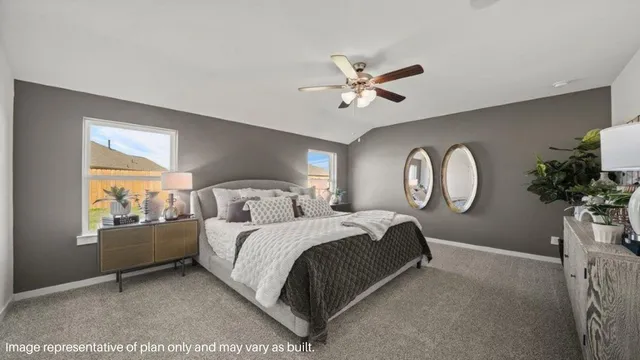 a bed room with a bed mirror and a window