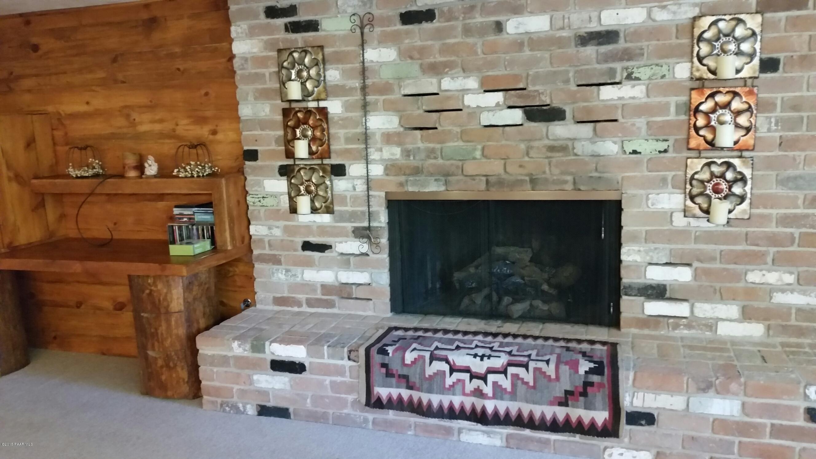 2527 Shadow Valley Ranch Road Prescott, AZ 86305 - Photo 27 of 28 Downstairs fireplace