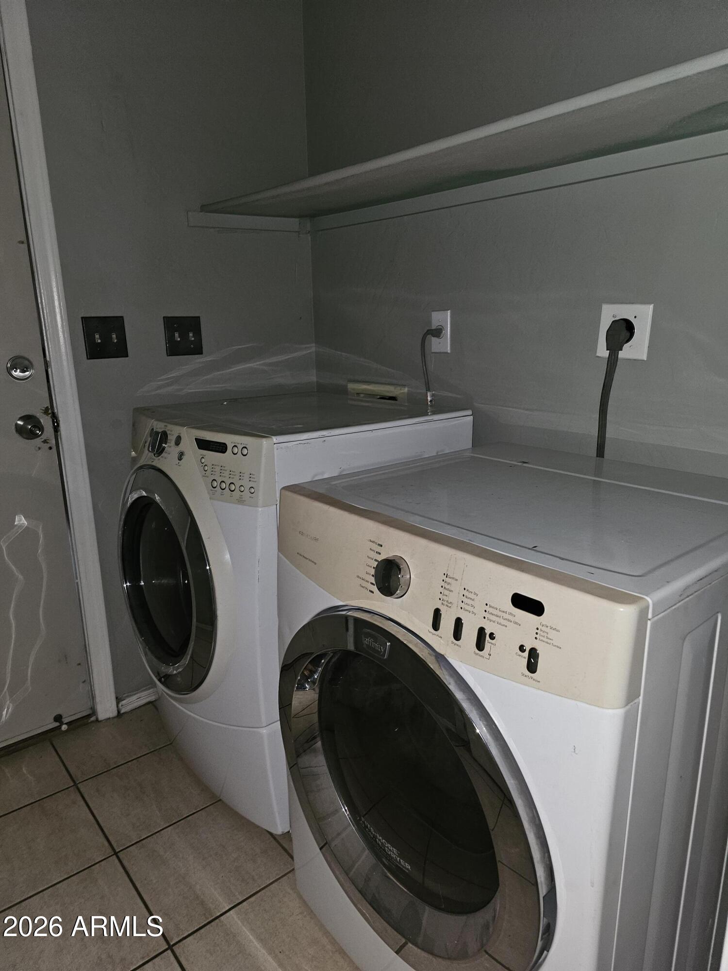 1489 West Page Avenue Gilbert, AZ 85233 - Photo 4 of 9 a utility room with dryer and washer
