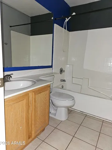a bathroom with a toilet a sink and bathtub