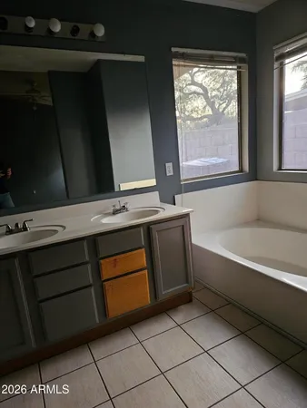 a bathroom with a bathtub and a window