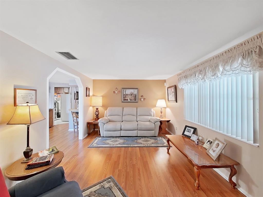 4105 Robinson Road Valrico, FL 33594 - Photo 16 of 58 a living room with furniture and a wooden floor
