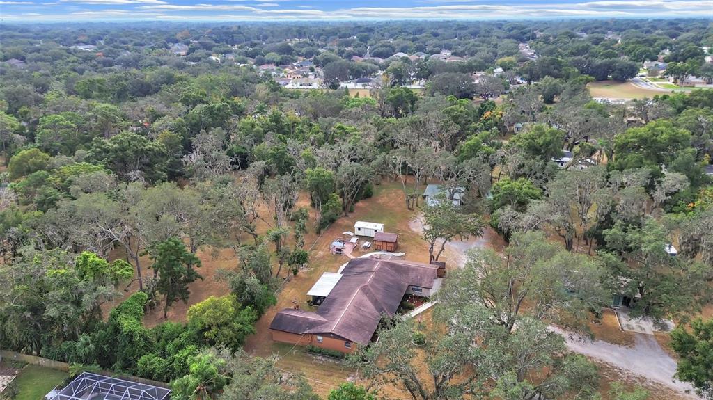 4105 Robinson Road Valrico, FL 33594 - Photo 2 of 58 an aerial view of a house with a yard