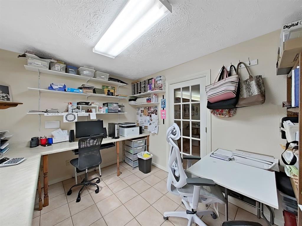 4105 Robinson Road Valrico, FL 33594 - Photo 29 of 58 a view of a workspace with furniture and a window