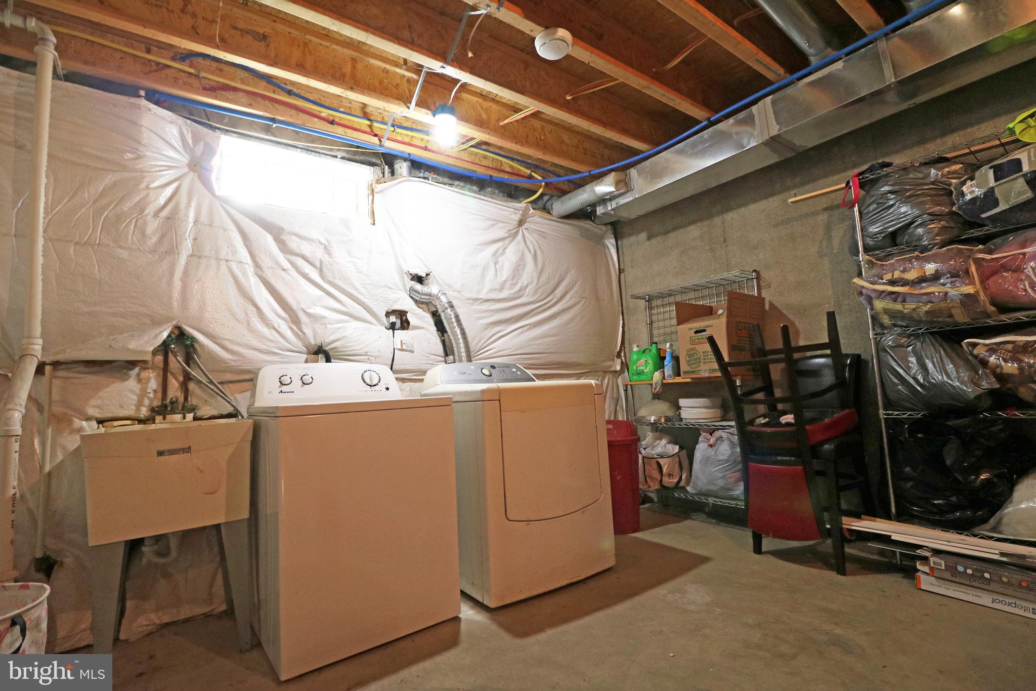 802 9th Street Chester, PA 19013 - Photo 14 of 43 a utility room with dryer and washer