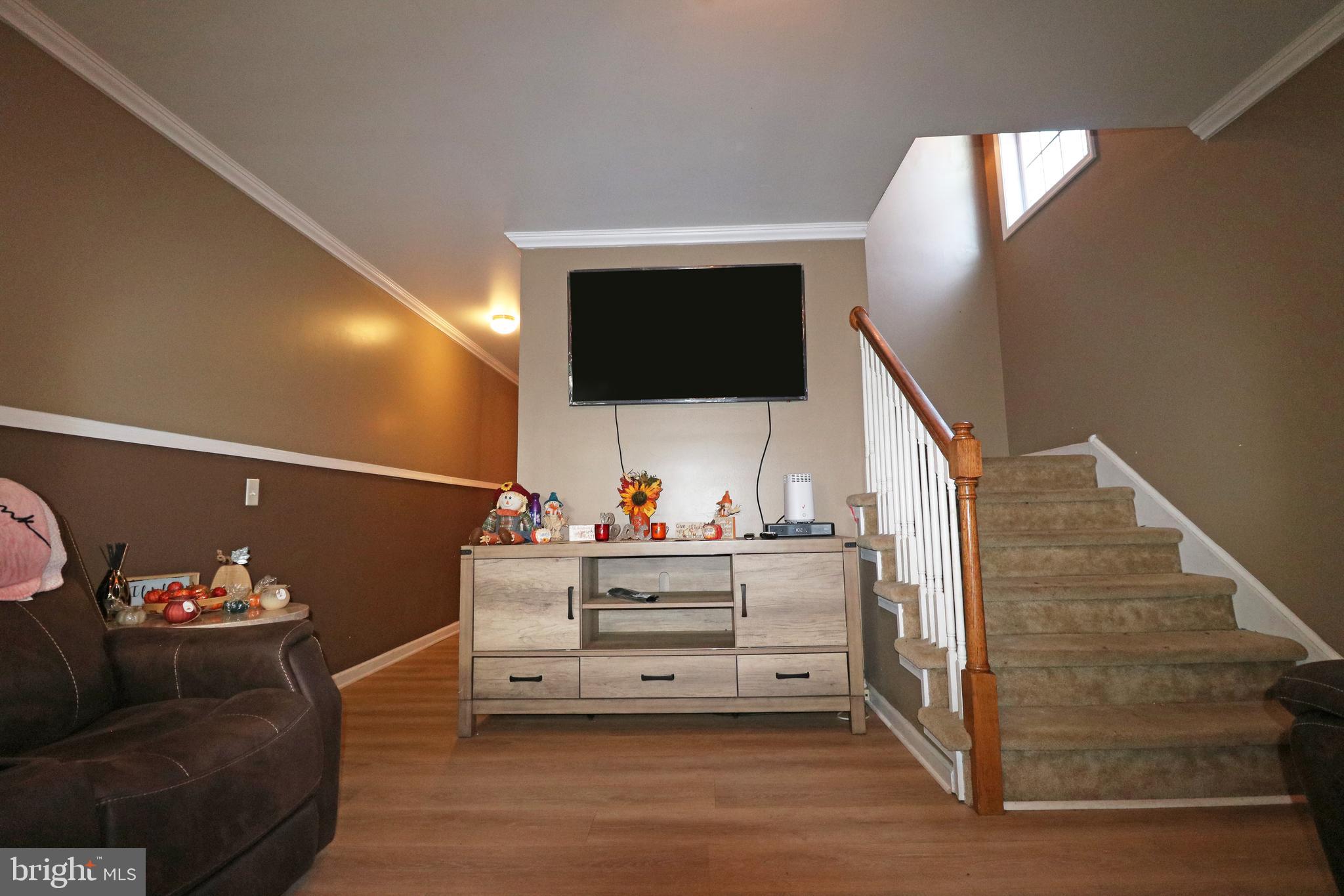 802 9th Street Chester, PA 19013 - Photo 15 of 43 a living room with furniture and a flat screen tv