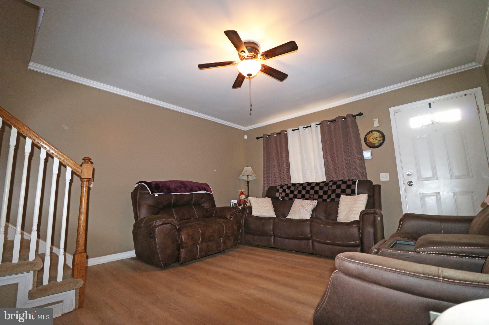802 9th Street Chester, PA 19013 - Photo 18 of 43 a living room with furniture and wooden floor