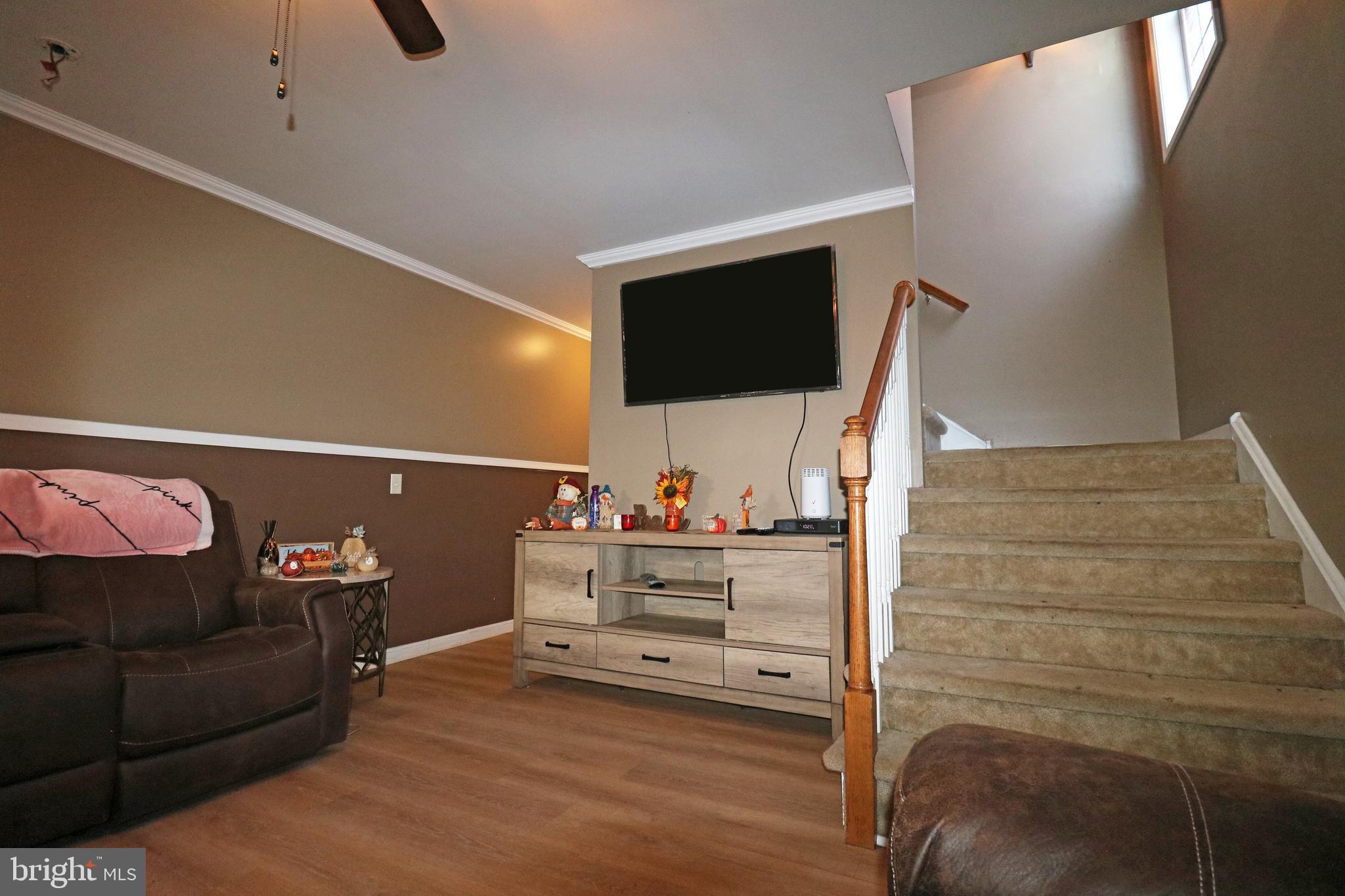 802 9th Street Chester, PA 19013 - Photo 19 of 43 a view of living room with furniture and a flat screen tv