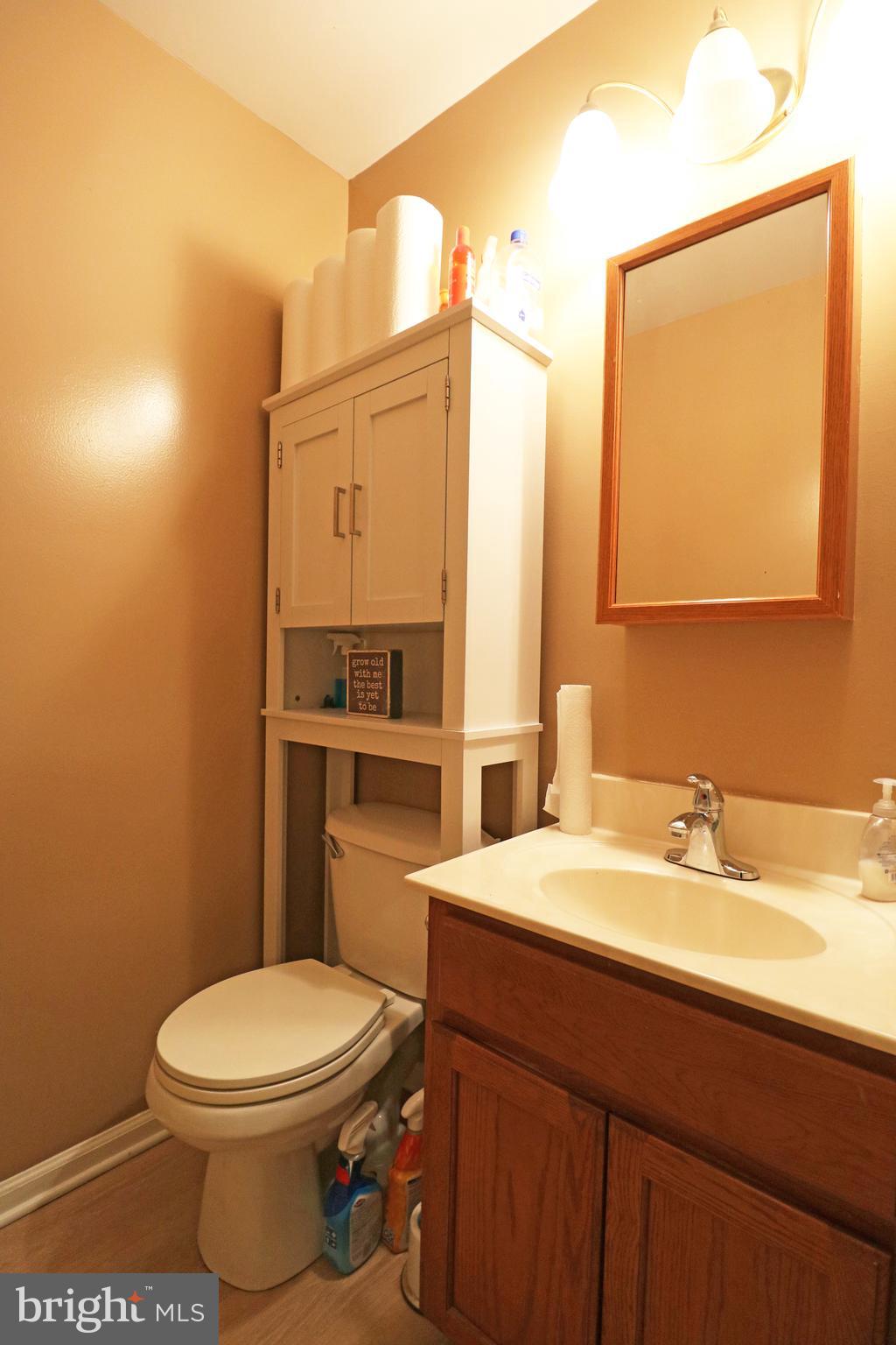 802 9th Street Chester, PA 19013 - Photo 22 of 43 a bathroom with a sink a toilet and mirror