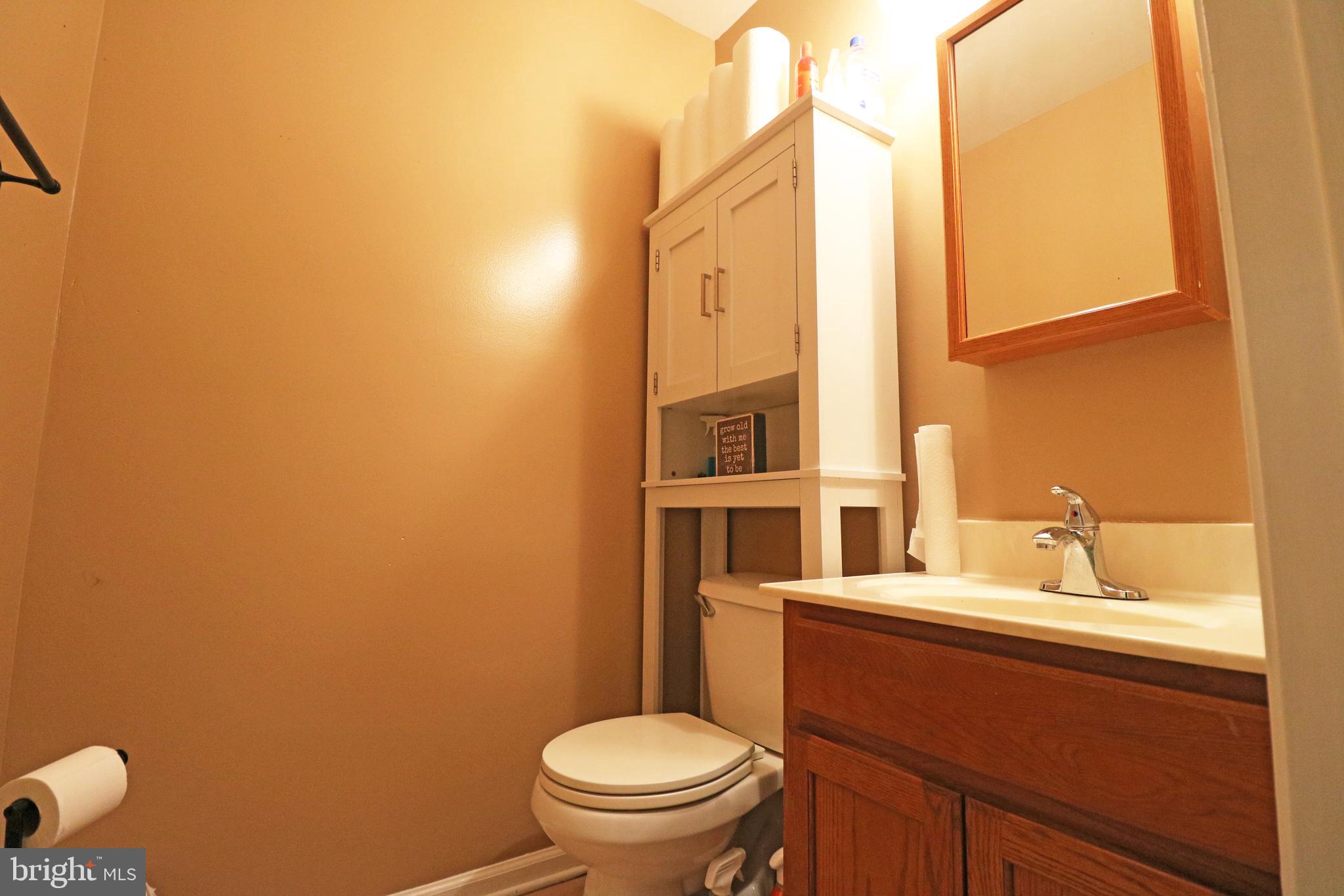 802 9th Street Chester, PA 19013 - Photo 23 of 43 a bathroom with a sink a toilet and a mirror