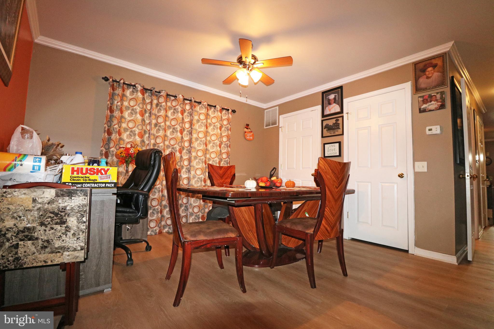 802 9th Street Chester, PA 19013 - Photo 29 of 43 a view of a dining room with furniture and wooden floor