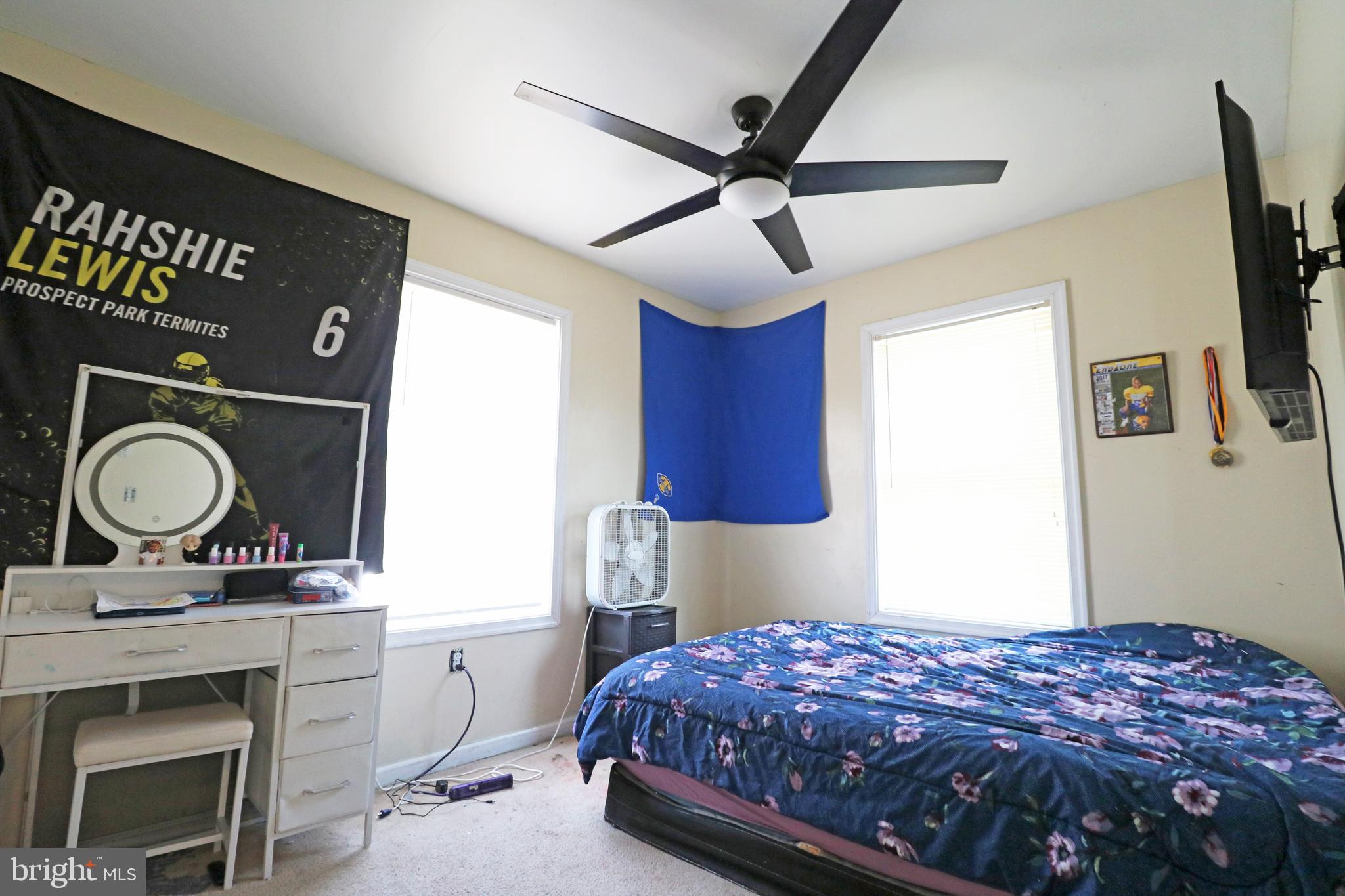 802 9th Street Chester, PA 19013 - Photo 31 of 43 a bedroom with a bed and a dresser