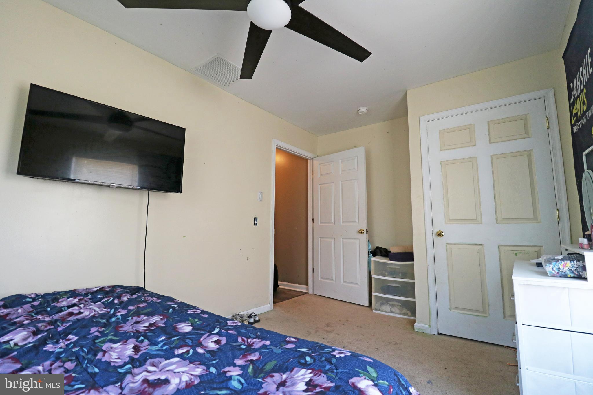 802 9th Street Chester, PA 19013 - Photo 32 of 43 a bedroom with a bed and a flat screen tv