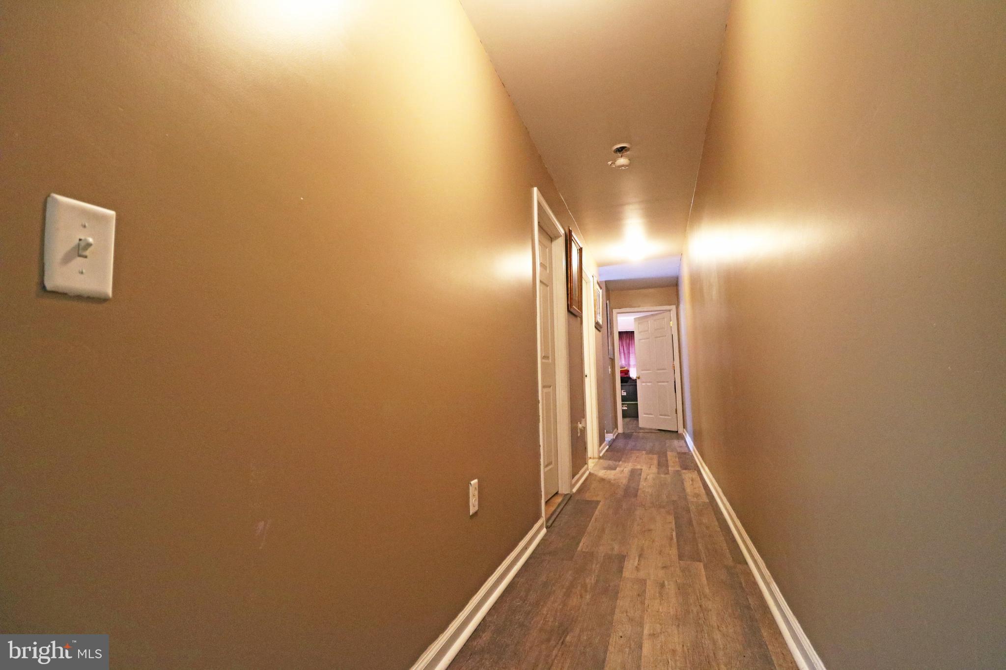802 9th Street Chester, PA 19013 - Photo 34 of 43 a view of a hallway with wooden floor