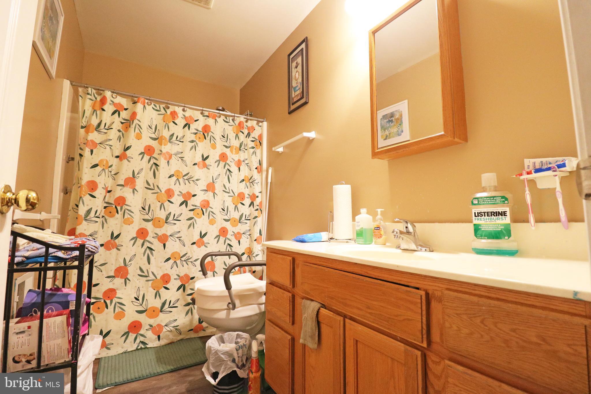 802 9th Street Chester, PA 19013 - Photo 38 of 43 a bathroom with a sink toilet and shower