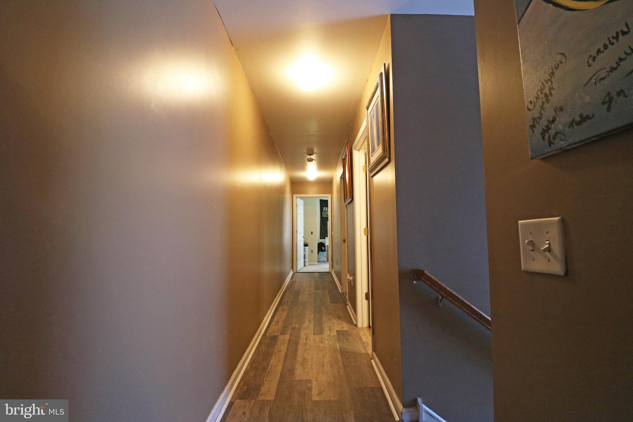 802 9th Street Chester, PA 19013 - Photo 39 of 43 a view of a hallway with wooden floor and staircase