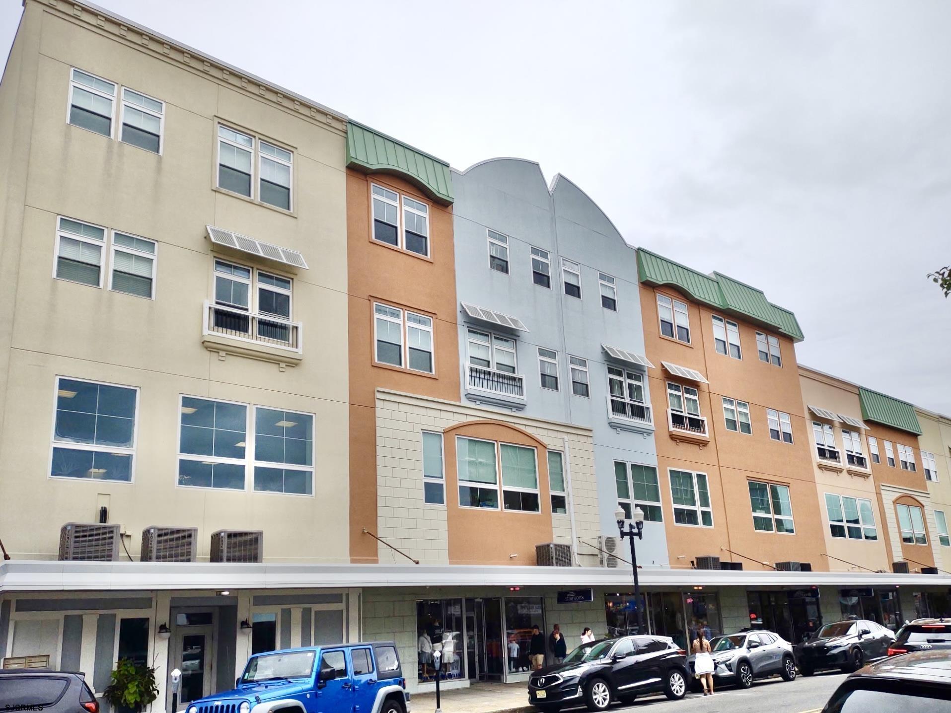 810 Asbury Avenue, Unit 303 Ocean City, NJ 08226 - Photo 1 of 20 a front view of an apartment building with balcony