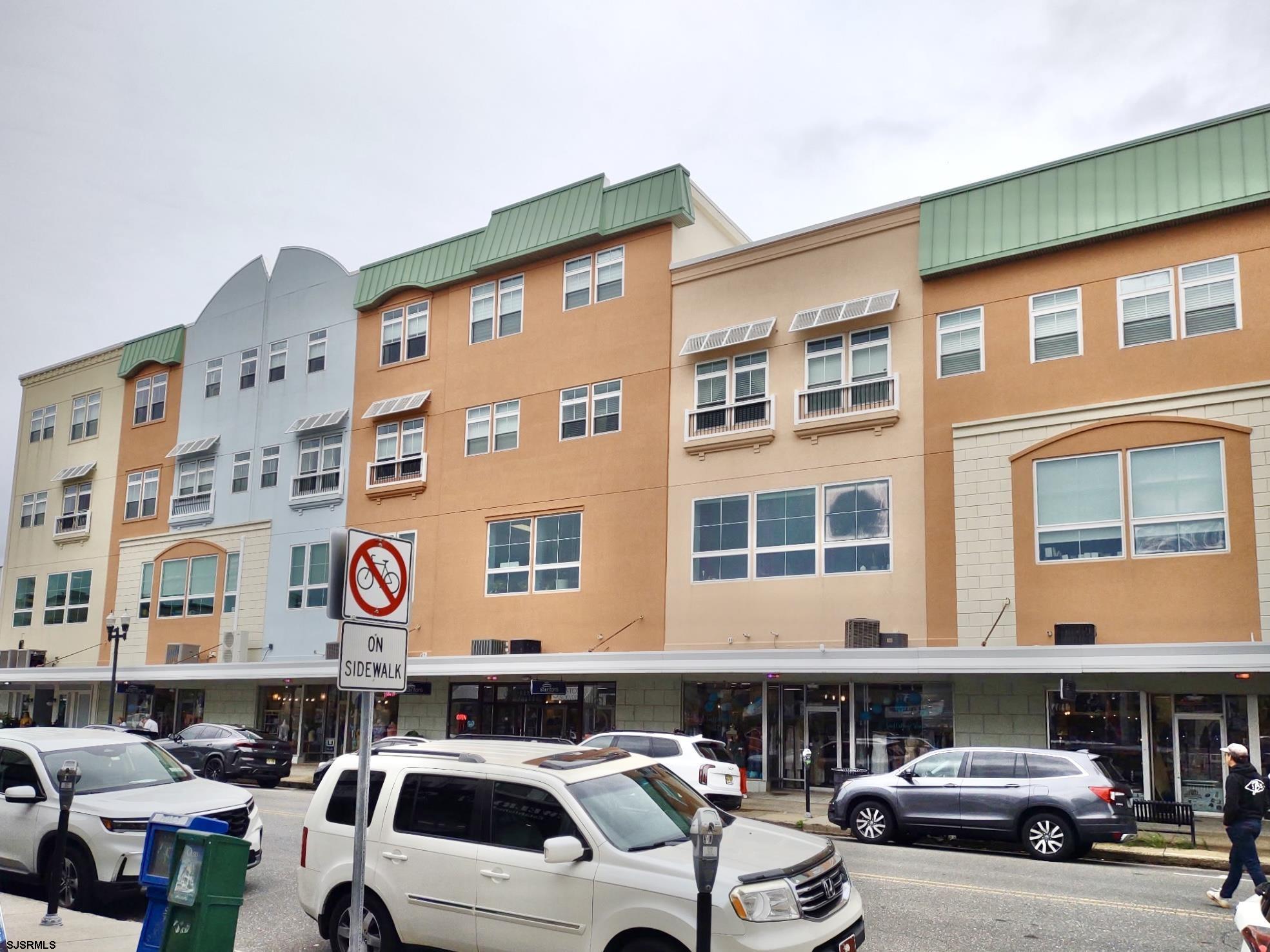 810 Asbury Avenue, Unit 303 Ocean City, NJ 08226 - Photo 2 of 20 a front view of a building with parking