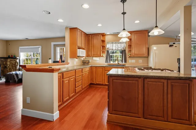 a large kitchen with lots of counter space and a sink