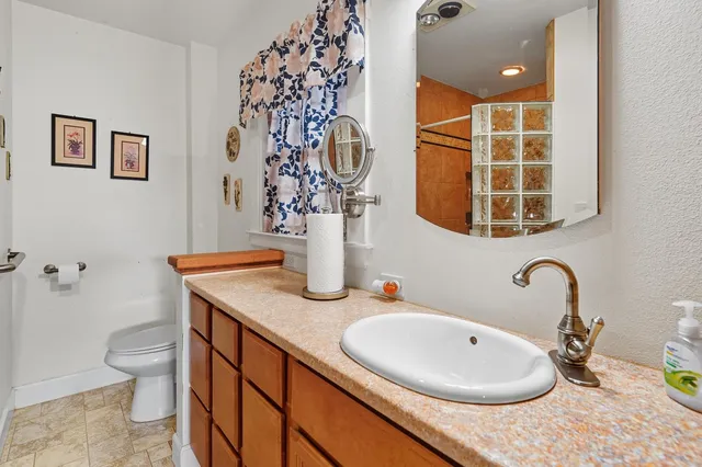 a bathroom with a sink and mirror