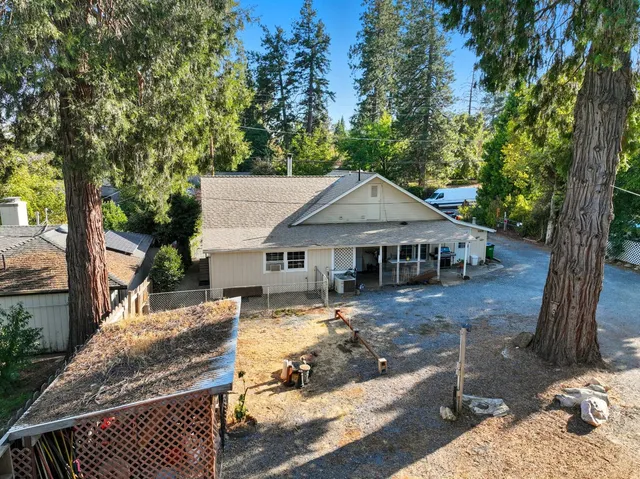 a house with trees in the background