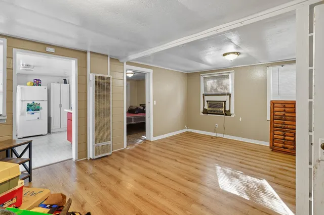 a view of livingroom with hardwood floor and hallway