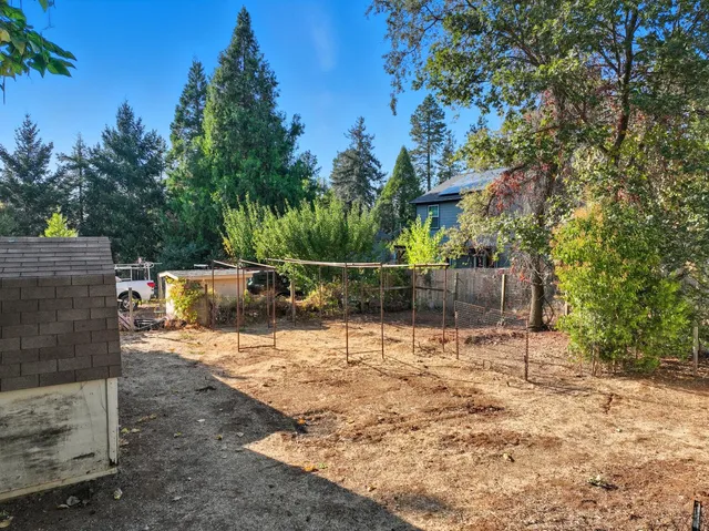 a backyard of a house with lots of green space