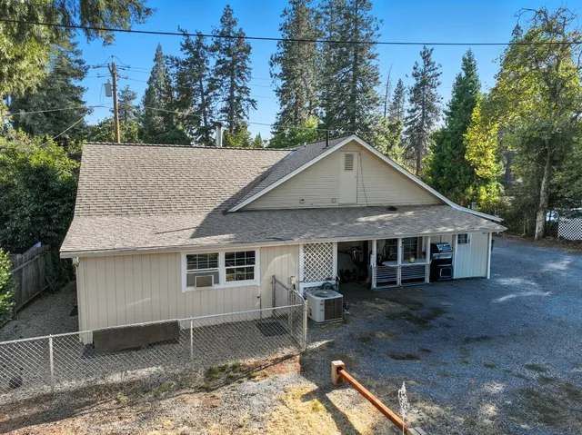 a house with trees in the background