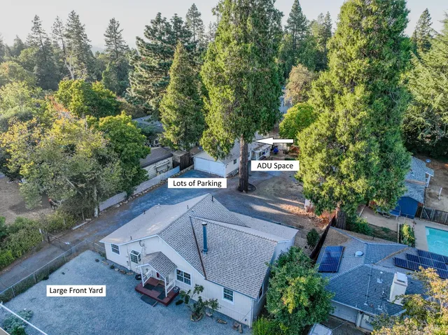an aerial view of a house with outdoor space