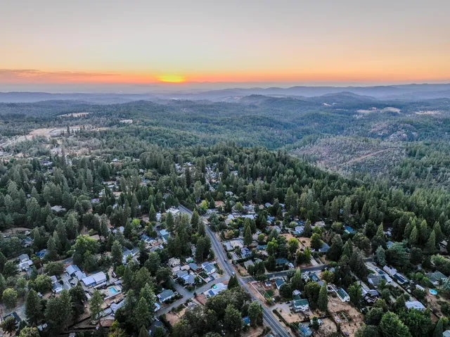 an aerial view of residential house and green space