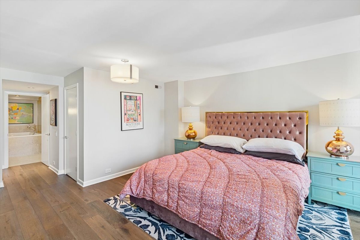 1030 North State Street, Unit 33GH Chicago, IL 60610 - Photo 14 of 26 a bedroom with a bed and closet