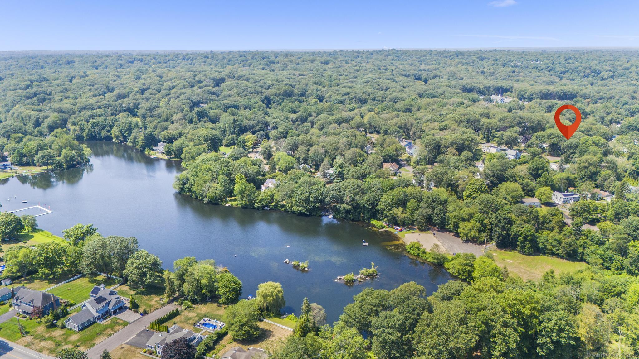 56 Nepas Road Fairfield, CT 06825 - Photo 1 of 1 an aerial view of a houses with a lake view
