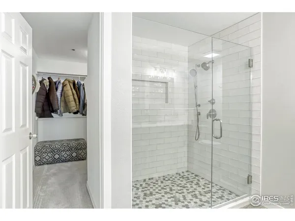 a bathroom with a shower and a sink