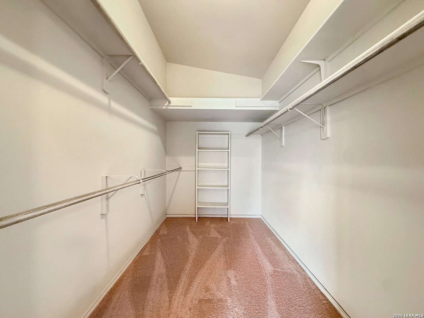 140 St Andrews Loop Kerrville, TX 78028 - Photo 14 of 24 a view of a room with racks on the wall